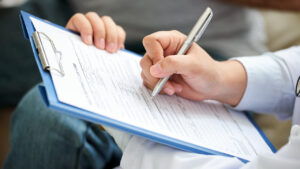 Crop doctor writing on clipboard
